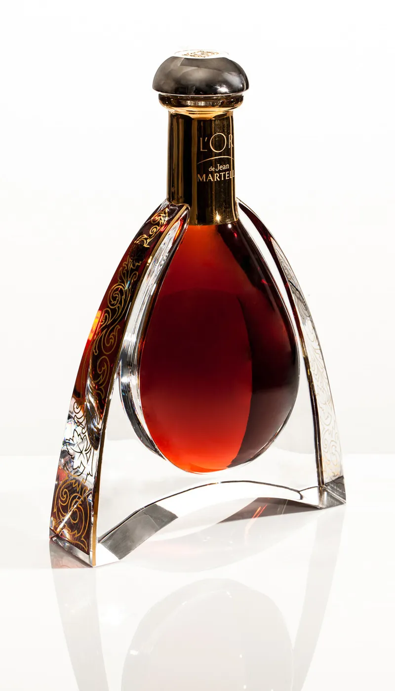 L'Or de Jean Martell cognac decanter, studio packshot on white with soft floor reflection